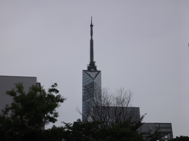 Fukuoka Tower above the treeline on an overcast day
