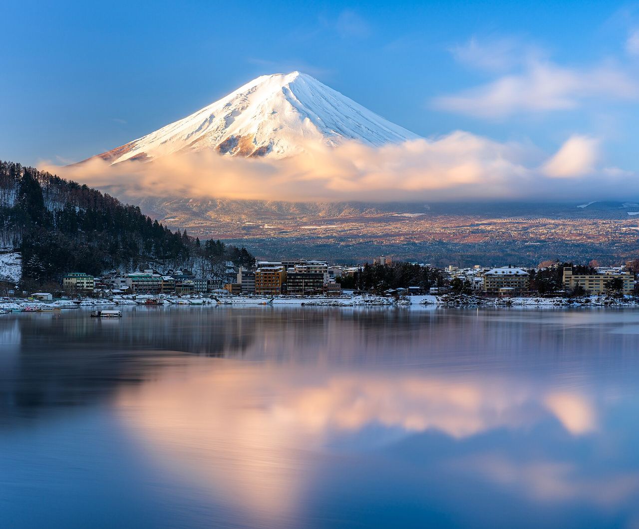 Mount Fuji at sunrise, reflected in a lake